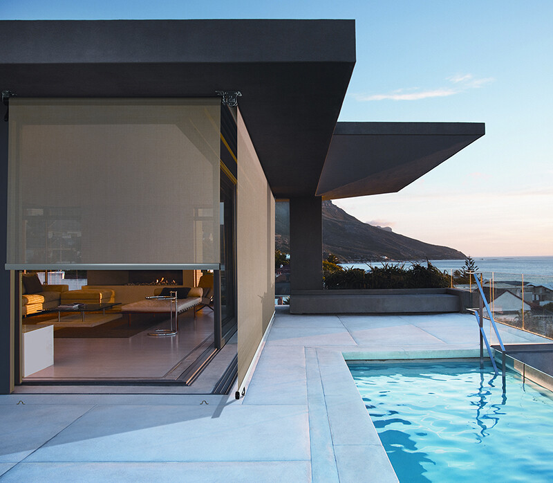 Modern living room and patio next to swimming pool